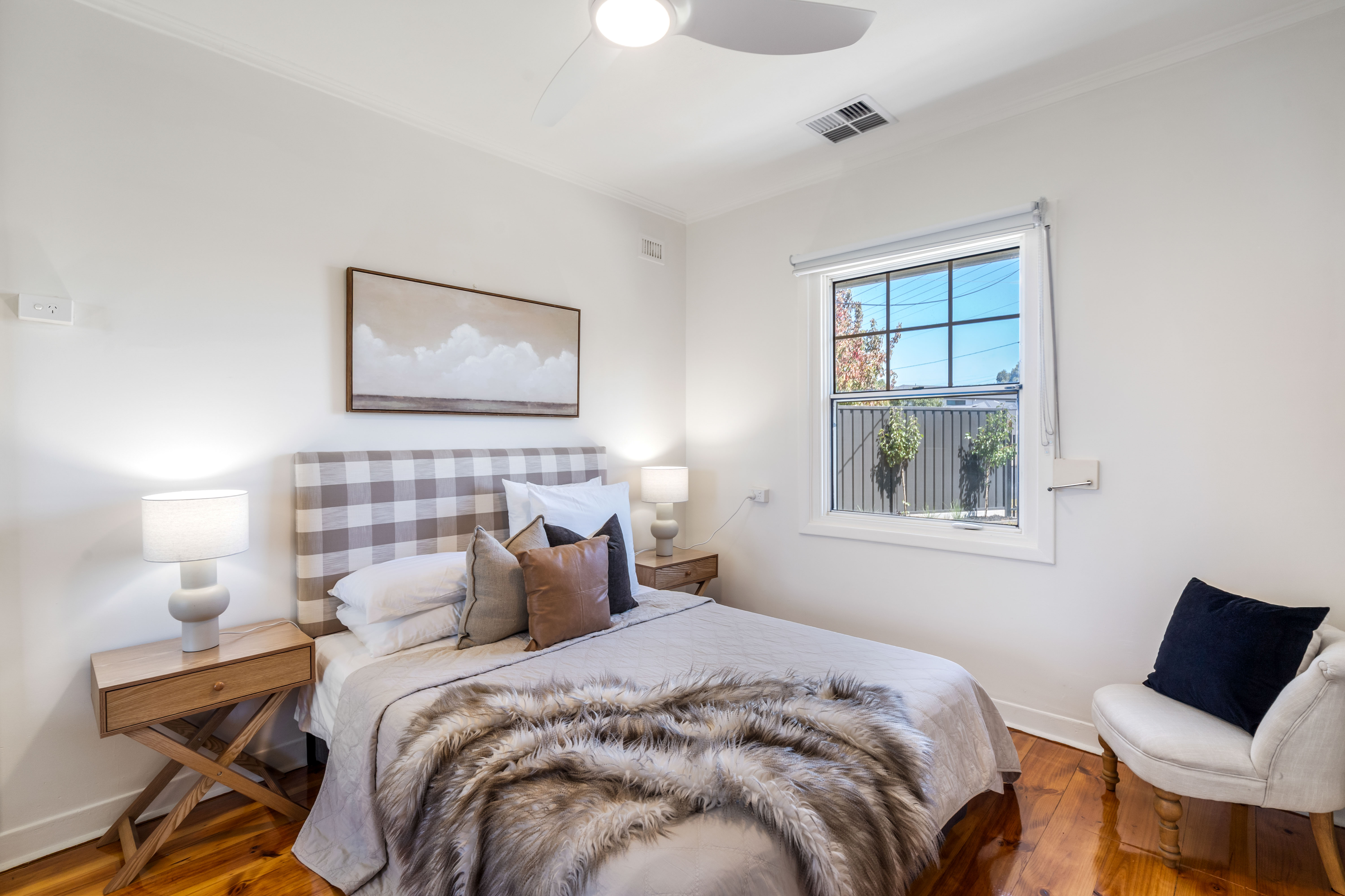Styled bedroom with timber floors